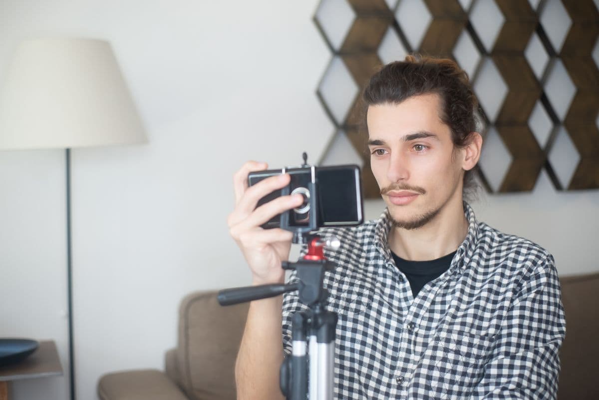 Creator filming content on a phone and tripod